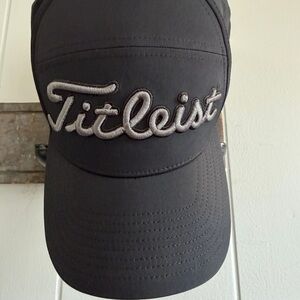 NWOT. Titleist Black Hat w/Contrasting Silver Embroidered Script Logo Mesh back